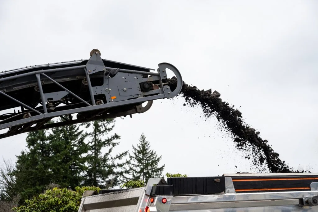cold planer dumping asphalt millings into a truck
