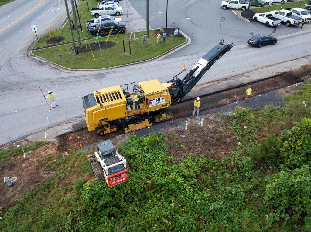 aerial view of major league milling cold planer on the side of a street